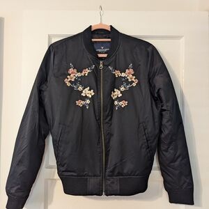 Black American Eagle Bomber Jacket with floral detail - Size Medium